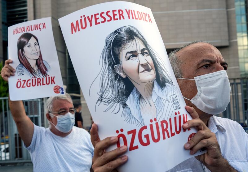 People hold posters depicting jailed journalists during a protest before a trial in front of the Caglayan courthouse in Istanbul, Turkey. According to Reporters Without Borders, 30 journalists are in prison in Turkey.  EPA