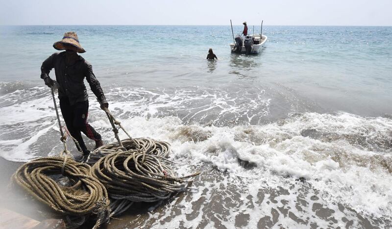 A fisherman on the coast of Fujairah on the eastern side of the UAE.  AFP