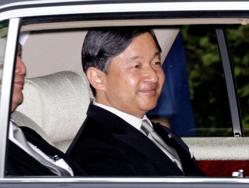 Japan's Crown Prince Naruhito, in a car, returns to the Crown Prince's Palace in Tokyo. Naruhito will ascend to the Chrysanthemum Throne on Wednesday. AP