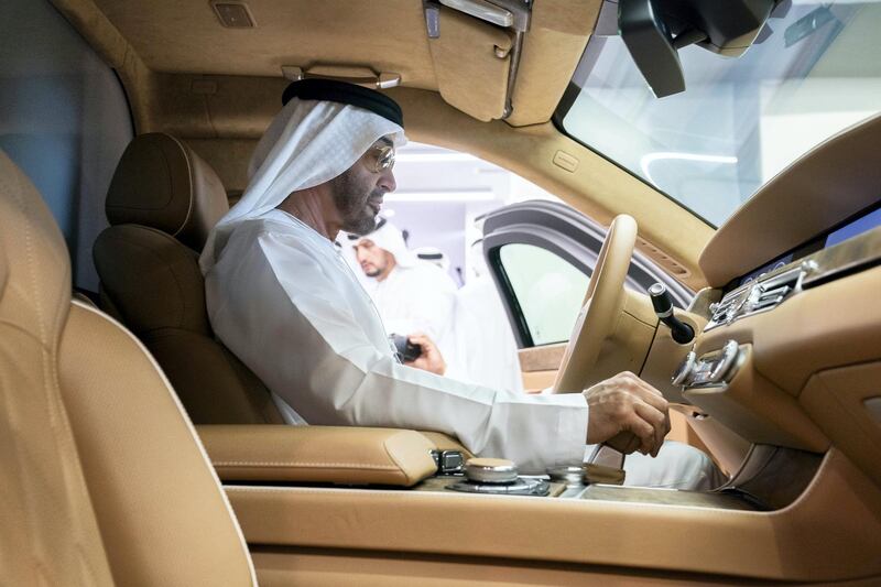 ABU DHABI, UNITED ARAB EMIRATES - February 18, 2019:  HH Sheikh Mohamed bin Zayed Al Nahyan, Crown Prince of Abu Dhabi and Deputy Supreme Commander of the UAE Armed Forces (C) inspects an Aurus vehicle during the 2019 International Defence Exhibition and Conference (IDEX), at Abu Dhabi National Exhibition Centre (ADNEC).

( Ryan Carter / Ministry of Presidential Affairs )
---
