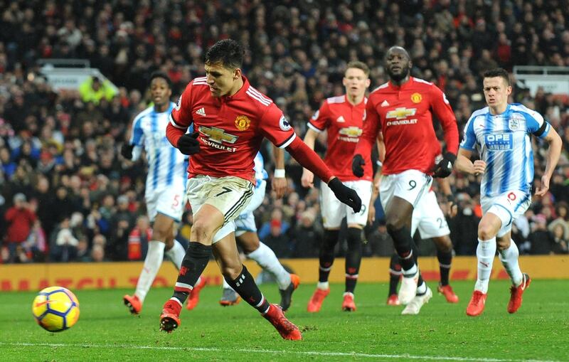 epa06494126 Manchester United’s Alexis Sanchez scores during the English Premier League soccer match between Manchester United and Huddersfield Town at Old Trafford in Manchester, Britain, 03 February 2018.  EPA/Rui Vieira EDITORIAL USE ONLY. No use with unauthorised audio, video, data, fixture lists, club/league logos 'live' services. Online in-match use limited to 75 images, no video emulation. No use in betting, games or single club/league/player publications.