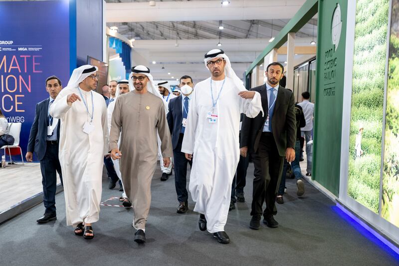 Sheikh Mohamed, second left, tours the conference. Rashed Al Mansoori / UAE Presidential Court 
