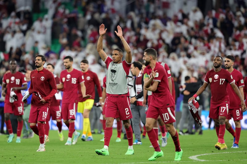 Qatar's players celebrate their win. AFP
