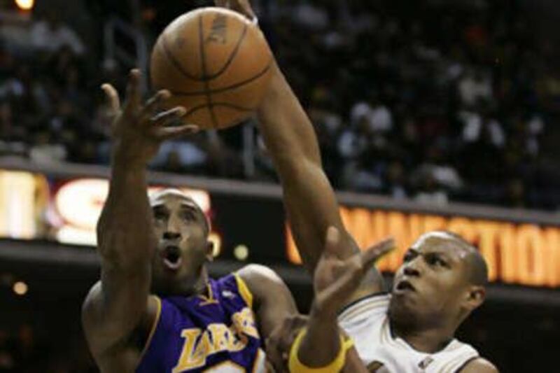 The Los Angeles Lakers' Kobe Bryant, left, in action with the Washington Wizards' Caron Butler, wants to win the play-offs.