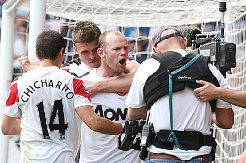 Wayne Rooney shouts into the camera after his hat-trick against West Ham United.