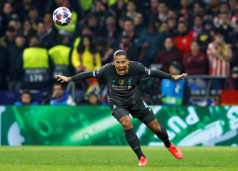 Liverpool's Virgil van Dijk heads the ball clear. Reuters