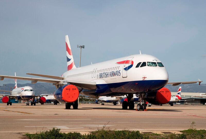 British Airways passenger planes are parked at Palma de Mallorca airport on January 21, 2021. Due to the pandemic travel restrictions, airlines have been forced to ground thousands of planes across Europe. / AFP / JAIME REINA
