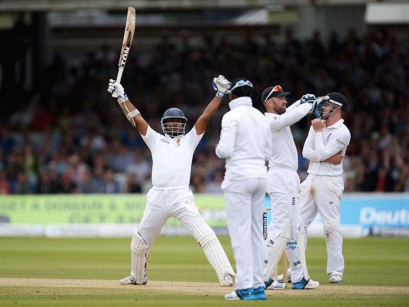 Kumar Sangakkara of Sri Lanka celebrates reaching his century during Day 3 of first Test against England on Saturday at Lord's Ground in London, England. Gareth Copley / Getty Images 