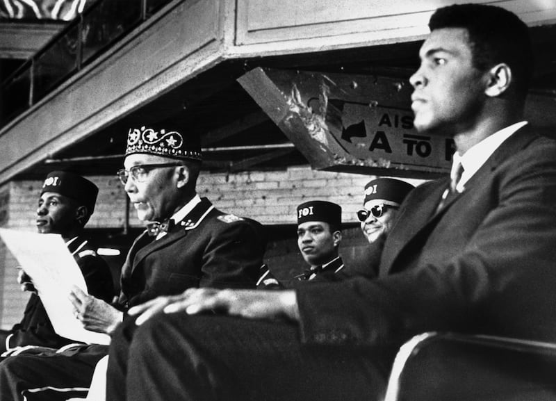 Ali with Nation of Islam leader Elijah Muhammad at a convention in Chicago in 1966. Getty