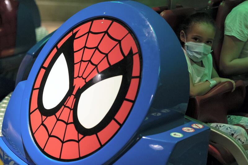 Dubai, United Arab Emirates - Reporter: N/A. Covid-19/Coronavirus. A young girl rides the Spiderman ride. IMG World of Adventure opened on recently to the public with strict Covid-19/Coronavirus safety measures. Tuesday, July 21st, 2020. Dubai. Chris Whiteoak / The National