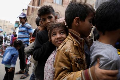 Children queue at a charity kitchen in Yemen's capital Sanaa, during the holy month of Ramadan. Reuters 