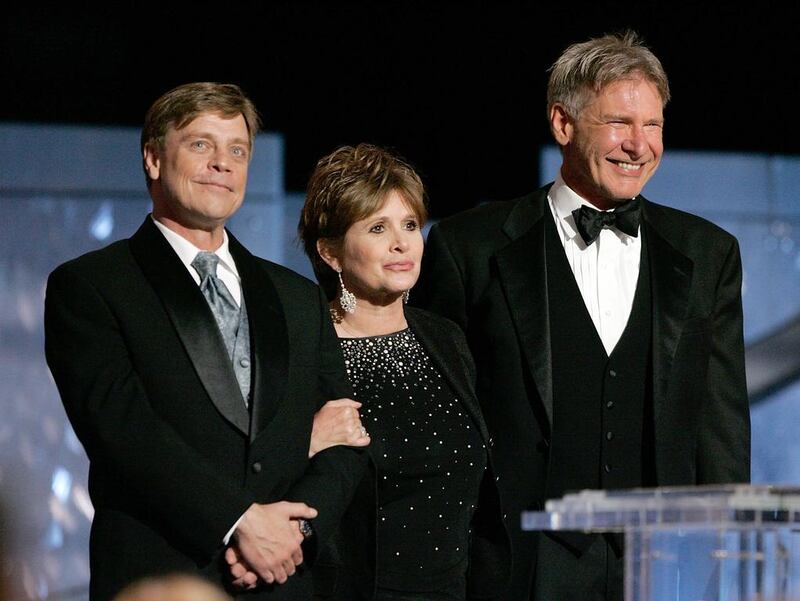 From left, Mark Hamill, Carrie Fisher and Harrison Ford are back in Star Wars: Episode VII. Vince Bucci / Getty Images / AFP
