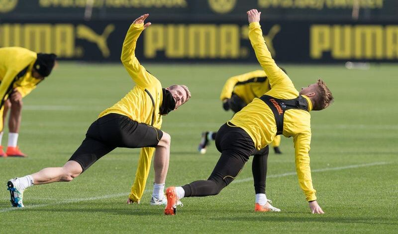 Borussia Dortmund’s Andre Schurrle, left, and Marco Reus at training. Guido Kirchner / DPA / AFP