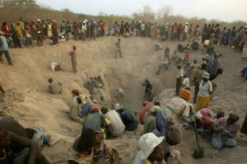 Miners dig for diamonds in Marange, Zimbabwe, Wednesday, Nov. 1, 2006. Police in Zimbabwe arrested 16,290 illegal miners, mostly gold panners, in a countrywide blitz that began just over a month ago, the official media reported Thursday, Dec. 28, 2006. (AP Photo/Tsvangirayi Mukwazhi)