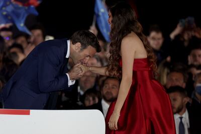 French President Emmanuel Macron greets Egyptian opera singer Farrah El Dibany following his victory in France's presidential election on Sunday. AFP