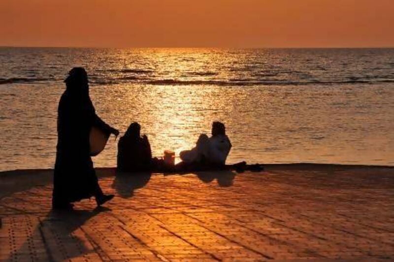 Saudis spend an evening on the seafront promenade in Jeddah, the setting for Abo Khal's disturbing novel Throwing Sparks.