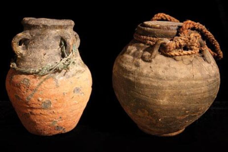 Two clay pots used to store butter milk and oil or ghee.