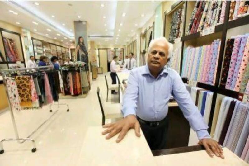 Parshotam A M, the manager of Regal textile, at the shop in Meena Bazaar.