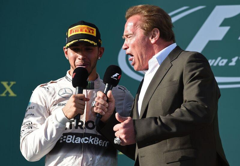 Lewis Hamilton talks to Arnold Schwarzenegger after winning the Australian Grand Prix. William West / AFP