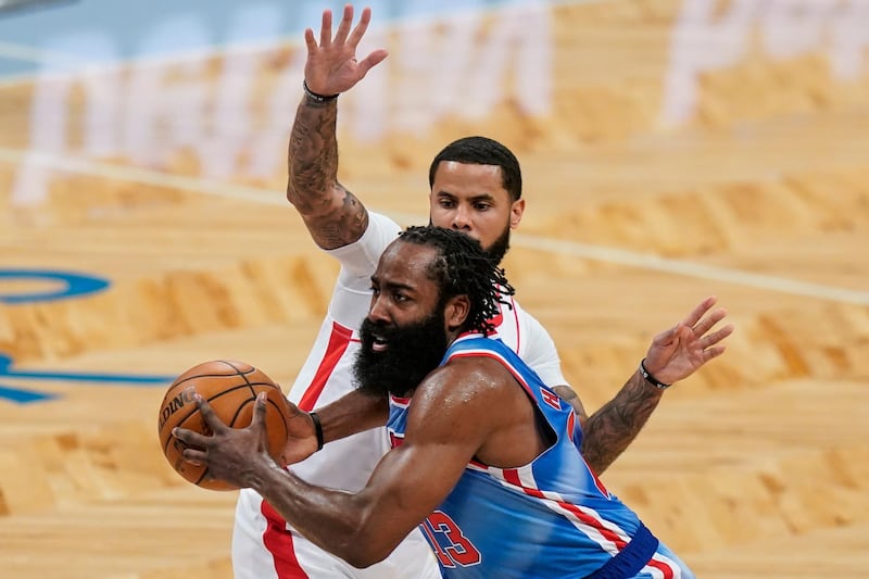 Brooklyn Nets' James Harden drives past Houston Rockets' D.J. Augustin during the first half of an NBA basketball game Wednesday, March 31, 2021, in New York. (AP Photo/Frank Franklin II)