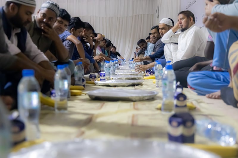 Muslims break their fast at an Emirates Red Crescent iftar tent. Wam