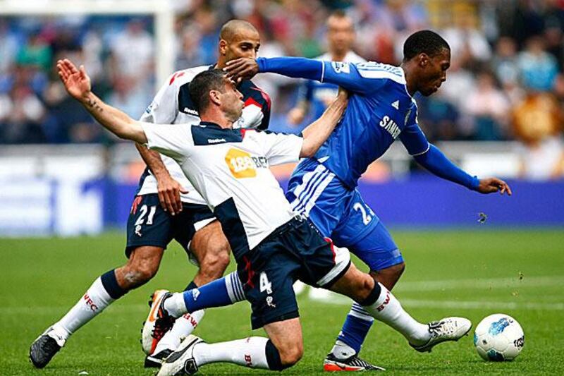 Daniel Sturridge, right, beats the challenge from the Bolton left-back paul Robinson. Sturridge, the striker, scored two for Chelsea in their 5-1 away win.

Tim Hales / AP Photo