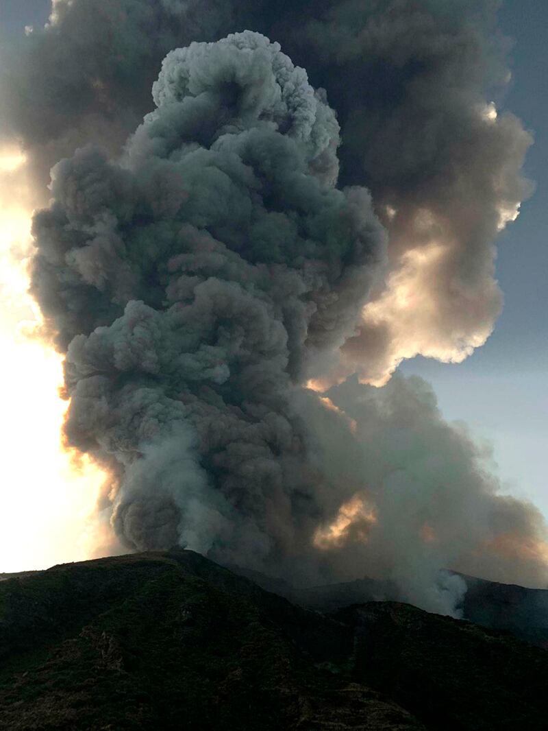 Smoke billows from the volcano on the Italian island of Stromboli. The news agency ANSA says that some 30 tourists jumped into the sea out of fear after a series of volcano erupted on the Sicilian island of Stromboli. Civil protection authorities said a hiker was confirmed killed by the eruptions. AP