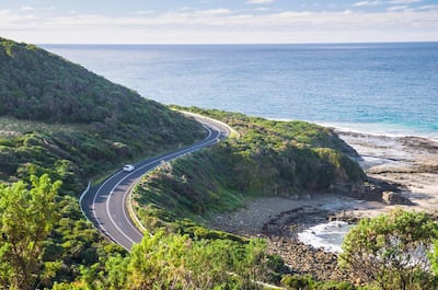 The waters of Bass Strait and a car on the Great Ocean Road, seen here between Kennett River and Skenes Creek, southern Victoria. Getty Images