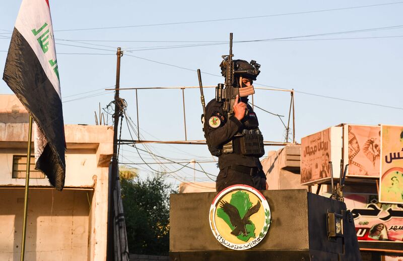 A member of the Iraqi security forces stands guard in the city of Tikrit, north of the capital, Baghdad, during the country’s parliamentary elections. Photo: AFP