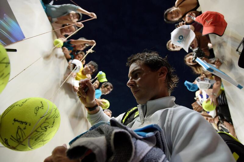 epaselect epa06453085 Rafael Nadal of Spain signs autographs after his win against Damir Dzumhur of Bosnia-Herzegovina at the Australian Open tennis tournament, in Melbourne, Victoria, Australia, 19 January 2018.  EPA/TRACEY NEARMY  AUSTRALIA AND NEW ZEALAND OUT