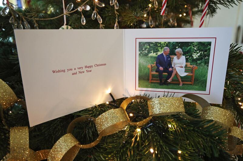 The 2018 Christmas card of the Prince of Wales and Duchess of Cornwall on a Christmas tree in Clarence House, London. Getty Images