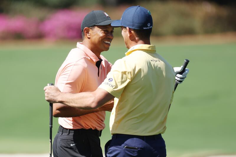 Tiger Woods greets Billy Horschel in the practice area at Augusta National Golf Club. Getty