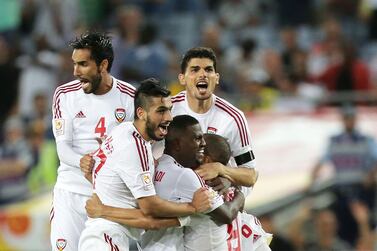 SYDNEY, AUSTRALIA - JANUARY 23: Ismail Ahmed of the United Arab Emirates celebrates with team mates after scoring the winning penalty during the 2015 Asian Cup Quarter Final match between Japan and the United Arab Emirates at ANZ Stadium on January 23, 2015 in Sydney, Australia. (Photo by Mark Metcalfe/Getty Images)
