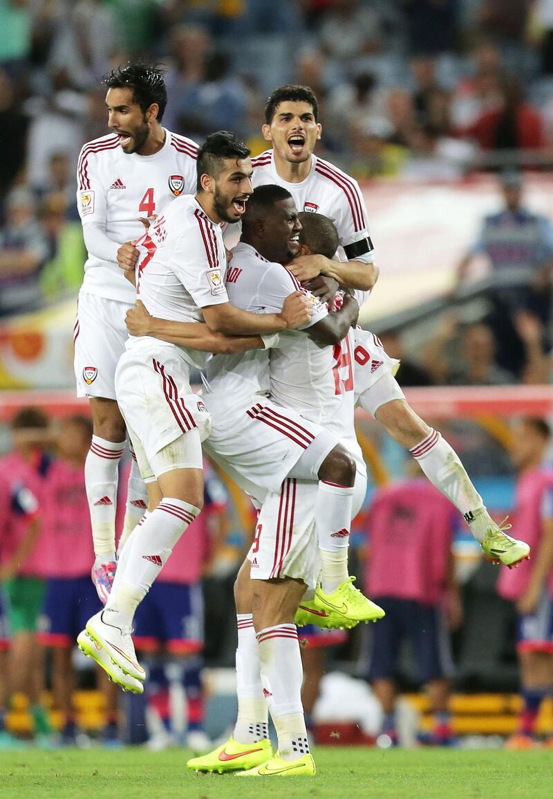SYDNEY, AUSTRALIA - JANUARY 23:  Ismail Ahmed of the United Arab Emirates celebrates with team mates after scoring the winning penalty during the 2015 Asian Cup Quarter Final match between Japan and the United Arab Emirates at ANZ Stadium on January 23, 2015 in Sydney, Australia.  (Photo by Mark Metcalfe/Getty Images)