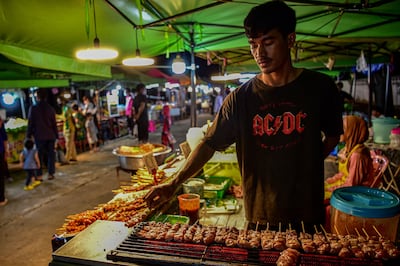 Street food vendors at a night market in the southern Thai province of Narathiwat. AFP