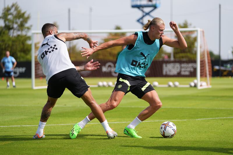 Manchester City's Erling Haaland and Kyle Walker battle for the ball during a training session at Houston Sports Park. All pictures Getty Images