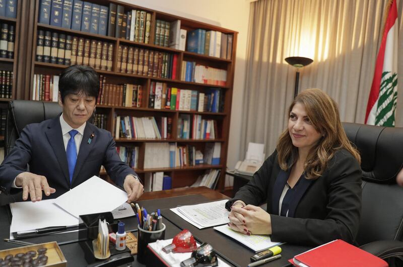 Lebanese Justice Minister Marie Claude Najm meets with Japan's deputy Justice Minister Hiroyuki Yoshiie in the capital Beirut, on March 2, 2020, to discuss the case of former Nissan Chairman Carlos Ghosn, currently a fugitive in his native Lebanon. - The 65-year-old businessman, for years venerated in Japan for turning around once-ailing Nissan, fled while awaiting trial on charges including allegedly under-reporting his compensation to the tune of $85 million. His shock arrival in Lebanon in December was the latest twist in a story which prompted outrage from the Japanese government as well as from Nissan. (Photo by ANWAR AMRO / AFP)