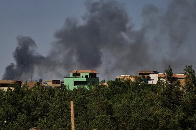 Smoke billows during fighting between forces of two rival Sudanese generals in Khartoum. AFP