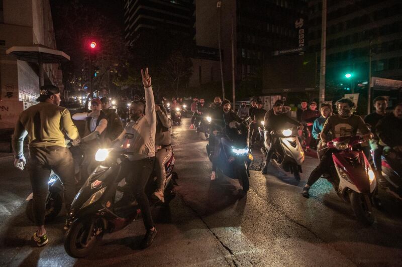 Anti-government protesters ride their motorcycles during a protest against the collapsing Lebanese currency and the price hikes of goods, in front the central bank in Beirut, Lebanon.  EPA