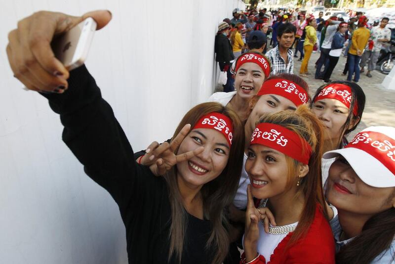 Cambodian workers attend a rally in Phnom Penh. Mak Remissa / EPA