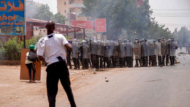 Sudanese anti-coup protesters face police during rallies against military rule in Khartoum.  AFP