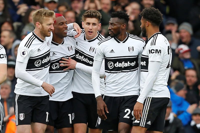 Fulham's Dutch defender Ryan Babel (2nd L) celebrates with teammates after scoring the opening goal of the English Premier League football match between Fulham and Cardiff City at Craven Cottage in London on April 27, 2019. (Photo by Ian KINGTON / AFP) / RESTRICTED TO EDITORIAL USE. No use with unauthorized audio, video, data, fixture lists, club/league logos or 'live' services. Online in-match use limited to 120 images. An additional 40 images may be used in extra time. No video emulation. Social media in-match use limited to 120 images. An additional 40 images may be used in extra time. No use in betting publications, games or single club/league/player publications. / 