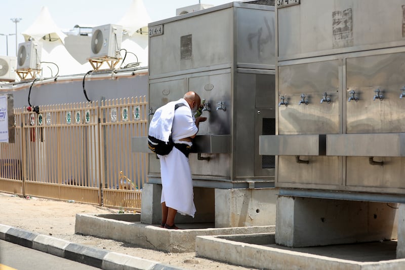 Man splashes face with cold water from taps set up for use during Hajj in Mina, near Makkah. Reuters