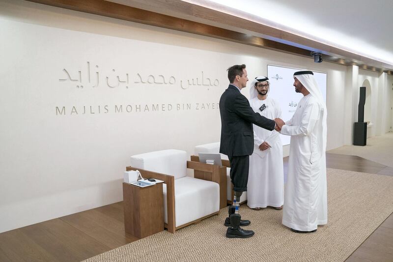 ABU DHABI, UNITED ARAB EMIRATES - May 28, 2018: HH Sheikh Mohamed bin Zayed Al Nahyan, Crown Prince of Abu Dhabi and Deputy Supreme Commander of the UAE Armed Forces (R) bids farewell to Professor Hugh Herr (L), after attending his lecture, titled ‘The New Era of Extreme Bionics’, at Majlis Mohamed bin Zayed.
 ( Hamad Al Kaabi / Crown Prince Court - Abu Dhabi )
---