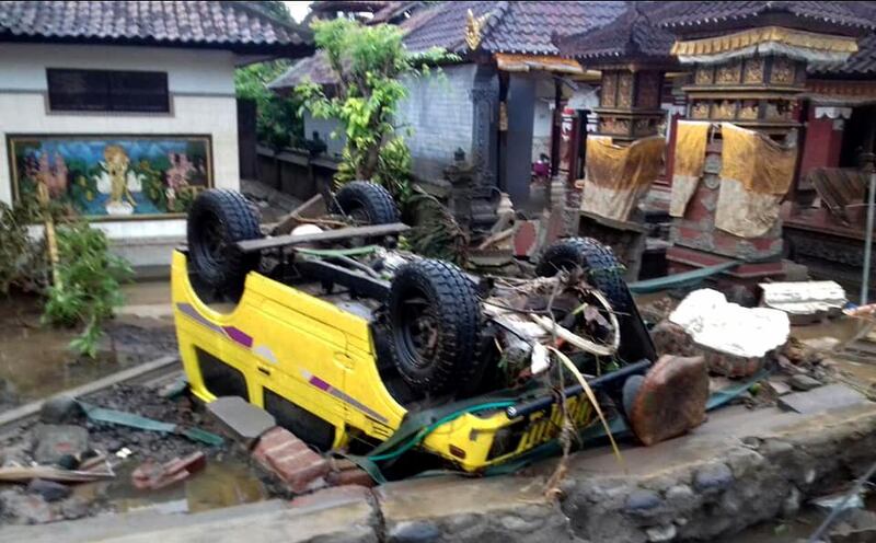 A ruined car that was rolled over after the tsunami struck in Anyer. EPA