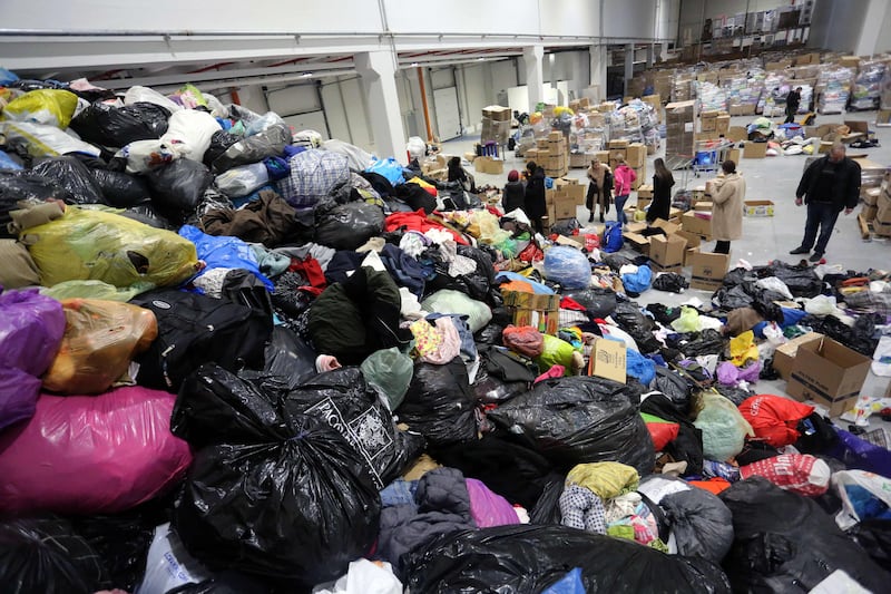 Volunteers of a local non-government organisation 'Pomozi. ba' help sort and pack donations, in Sarajevo, capital of Bosnia and Herzegovina. AFP