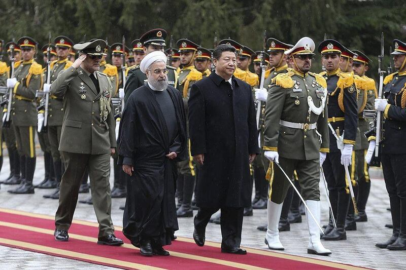 Iranian President Hassan Rouhani and Chinese President Xi Jinping review the honour guard during a welcoming ceremony in Tehran, Iran January 23, 2016. Reuters