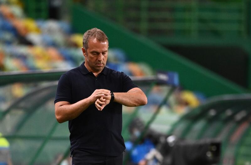 Bayern's interim head coach Hans-Dieter Flick looks at the clock. AP