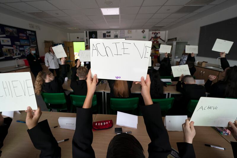 Year 7 pupils at Great Academy Ashton. Millions of children are returning to school across Britain with new air and virus-testing regimes aimed at preventing an explosion of cases among the least vaccinated section of the population. AP Photo