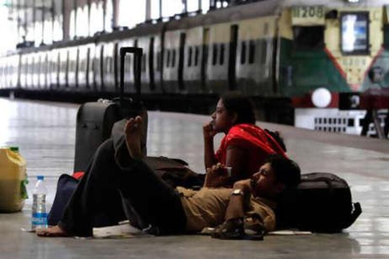 A stranded couple waits on a railway platform during a strike in Calcutta, India.